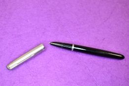 A Parker 51 fountain pen in black with brushed steel cap. Approx 13.7cm