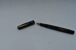 A Mabie Todd & Co Swan 6142 Self filler leverfill in grey marble with a single narrow gold bands