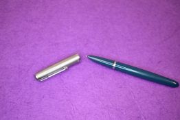 A Parker 51 fountain pen in teal green with brushed steel cap. Approx 14cm.