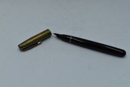 A Mentmore 46 button fill fountain pen in dark red, with silver cap . Approx 13.3cm. Silver rubber