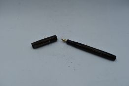 A fountain pen The Chatsworth Pen in HBR which has faded to green, leverfill, with a 14ct gold nib