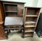 A late 19th century oak bureau bookcase on cabriole legs together with a pair of oak bookcases