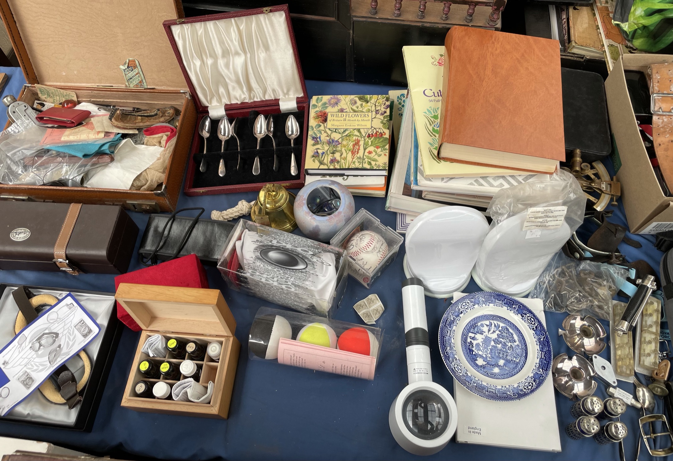 A watch case together with cased spoons,
