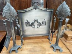A white metal fire screen of pointed arch form,