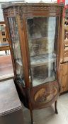 A French walnut and gilt metal mounted vitrine with a marble inset top with three quarter gallery