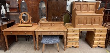 A pine box settle together with a pine desk, a pine side table, another pine desk,