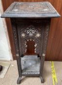 An Anglo Indian carved side table with a square top and arched sides with square legs