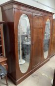 An Edwardian mahogany triple wardrobe,