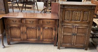 A 20th century oak sideboard with a rectangular top above three drawers and three cupboards on