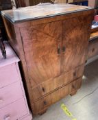 A 20th century walnut tallboy together with an oak tea trolley