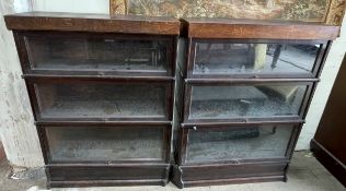 A pair of oak three section Globe-Wernicke sectional bookcases