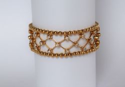 An 18ct yellow gold diamond set bracelet, with forty five round brilliant cut diamonds, 18cm long,