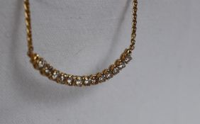 A 14ct yellow gold diamond set necklace,