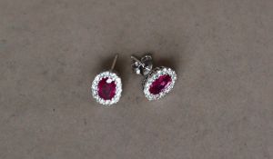 A pair of ruby and diamond earrings,