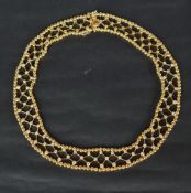An 18ct yellow gold diamond set necklace, set with seventy three round brilliant cut diamonds,