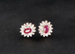 A pair of ruby and diamond earrings,