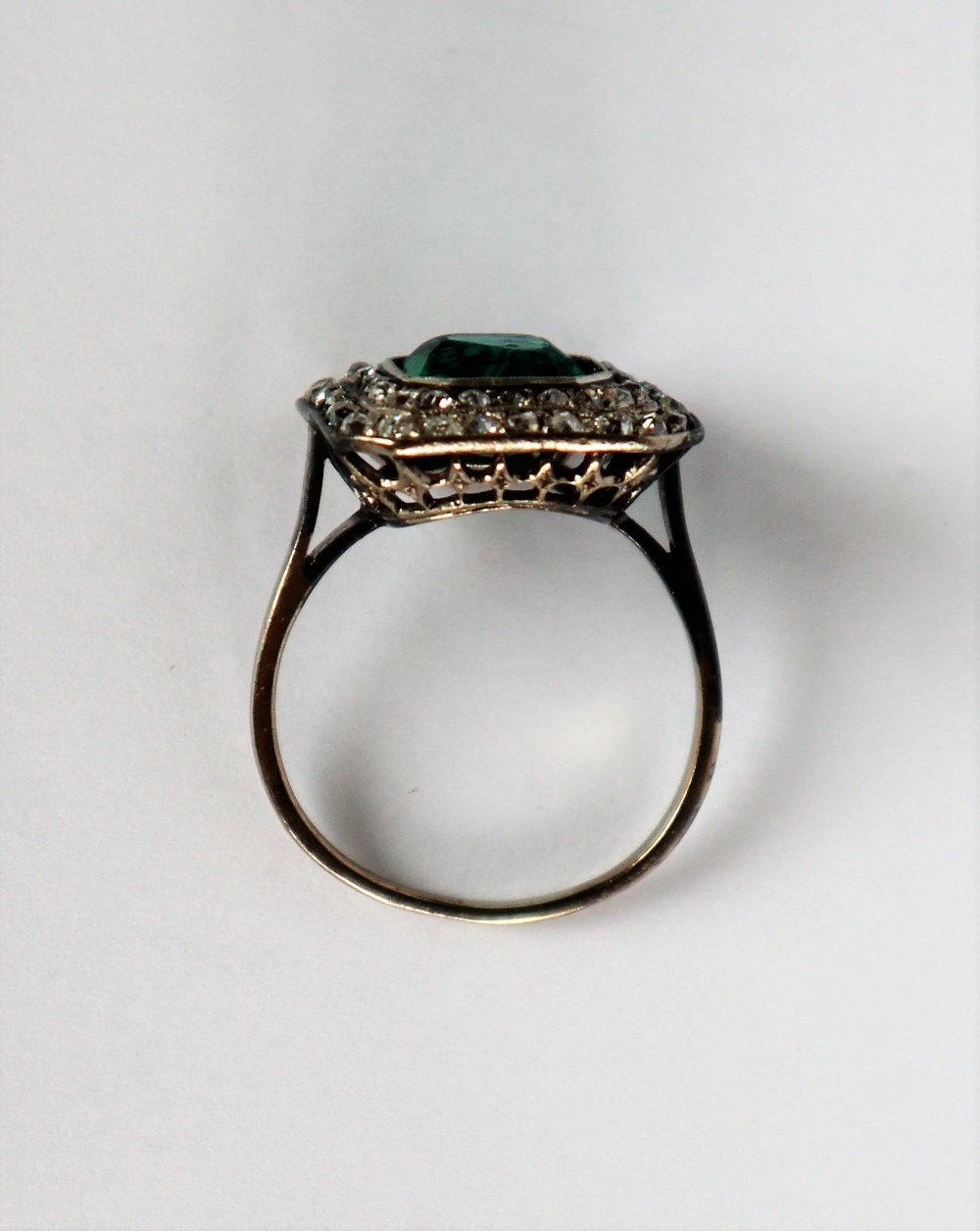 A dress ring set with diamonds and a princess cut green stone to a white metal setting and shank, - Image 5 of 7