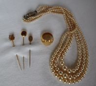 An 18ct gold signet ring, with an oval shield and leaf cast shoulders approximately 17.