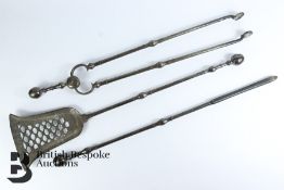 A Set of Heavy Cast-Metal Fire Irons
