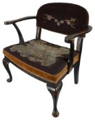An early 20th century japanned black lacquer and gilt chinoiserie open armchair
