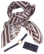 An Yves Saint Laurent ladies gilt quartz strap watch