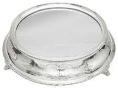 A mid 20th century electroplated circular mirror plateau or wedding cake stand