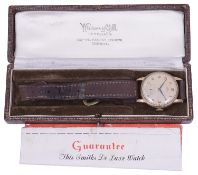 A gentleman's 9ct gold Smiths mechanical strap watch