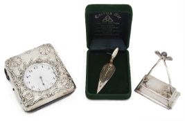 A late Victorian embossed silver and leather travel watch case; others