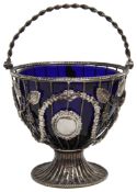 A Victorian silver wirework swing handled sugar basket