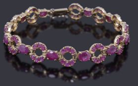 A gold ruby set line bracelet