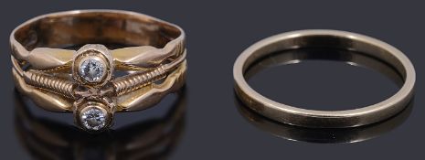 A gold two stone diamond ring,
