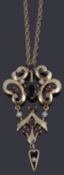 A garnet, seed pearl and 9ct yellow gold brooch/pendant