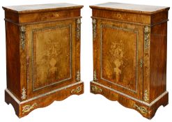 A pair of Victorian figured walnut and floral marquetry inlaid pier cabinets