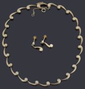A diamond set and 9ct yellow gold flexible link necklace, with a matching pair of ear pendants,