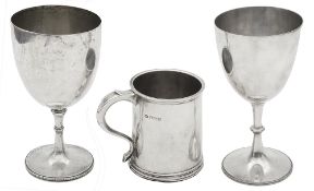 A late 19th century Indian colonial presentation silver trophy cup and a silver half pint mug