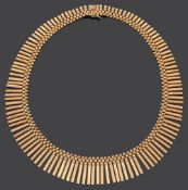 A Continental 18ct gold Egyptian style fringe necklace