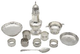 An Edwardian silver octagonal baluster sugar caster; others