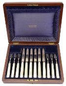An Edward VII silver and mother of pearl handled set of fruit knives and forks