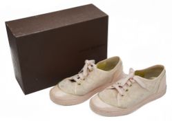 A pair of Louis Vuitton pale pink and gold monogrammed trainers