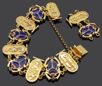 An Egyptian revival style yellow metal and enamel scarab bracelet