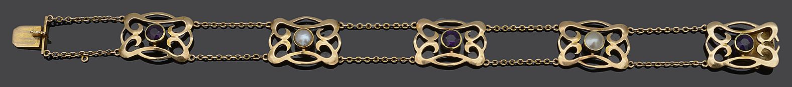 An Art Nouveau amethyst and blister pearl scroll panel bracelet