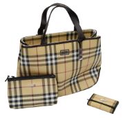 A Burberry handbag, make up bag and key wallet