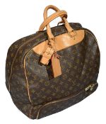 A Louis Vuitton monogrammed travel bag