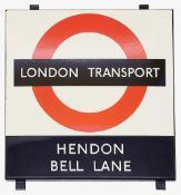 A London Transport enamel Bus stop sign 'HENDON / BELL LANE',1950s/60s, black and red roundel on a