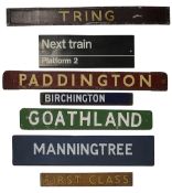 A group of enamel, metal, wooden and cardboard Railway-related signs