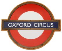 A London Underground Oxford Circus enamel 'bullseye' roundel sign,in bronze frame and mounted on