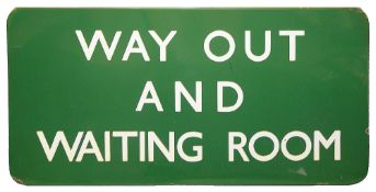 A BR(S) region enamel sign displaying 'WAY OUT AND WAITING ROOM',with white lettering on a green
