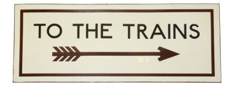 A London Underground enamel sign displaying 'TO THE TRAINS',black lettering on a white ground with