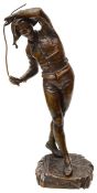An early 20th century French patinated bronze of a harlequin