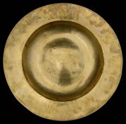 A large Arts and Crafts brass charger,